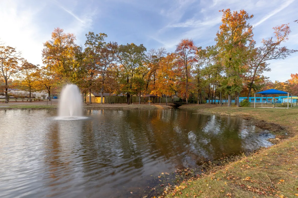 The fountain and pond at City Hall Park in Sherwood, Arkansas, in autumn