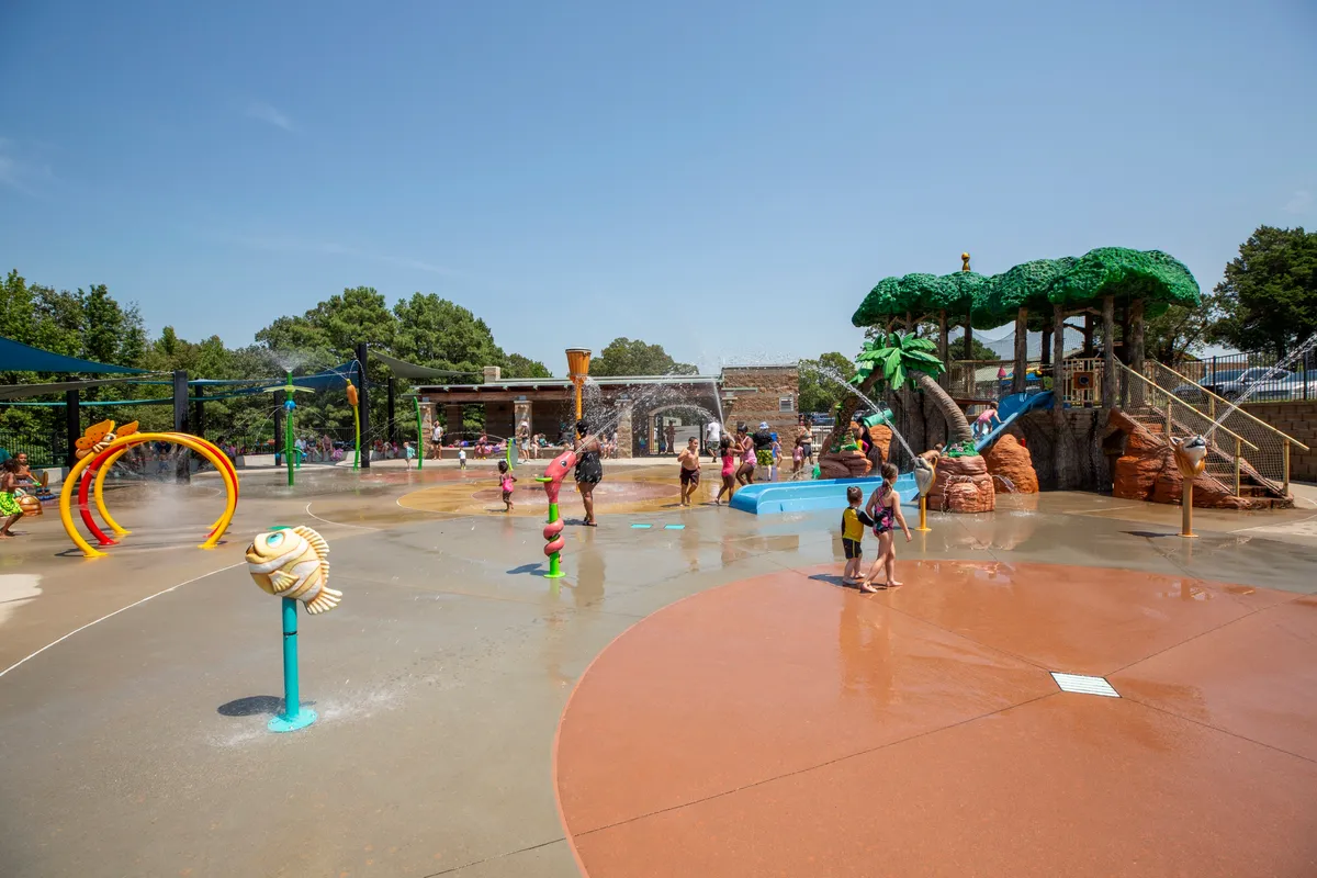 Children playing at the Sherwood splash pad on a summer day